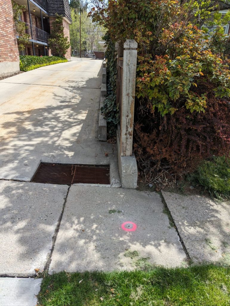 old rivets in sidewalks